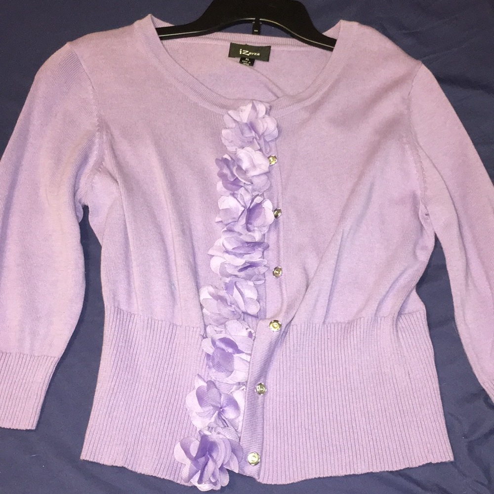 purple cardigan/sweater.